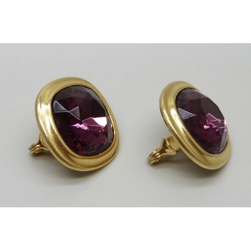 7151 - A pair of large Yves Saint Laurent clip on earrings with faceted purple stones, signed YSL, 2.8cm