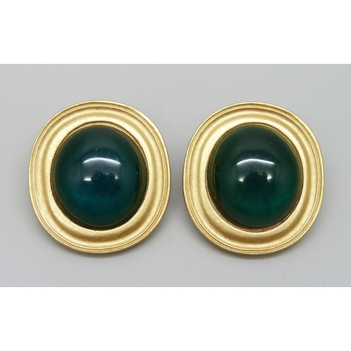 7152 - A pair of large Yves Saint Laurent clip on earrings with cabochon green stones, signed YSL, 3.2cm