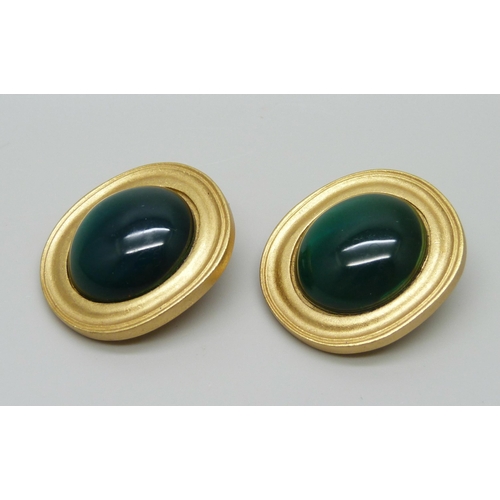 7152 - A pair of large Yves Saint Laurent clip on earrings with cabochon green stones, signed YSL, 3.2cm