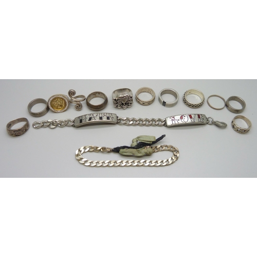 7164 - Seven silver rings, 45g, plated rings, a plated ID bracelet, an Ed Hardy skull ring etc.