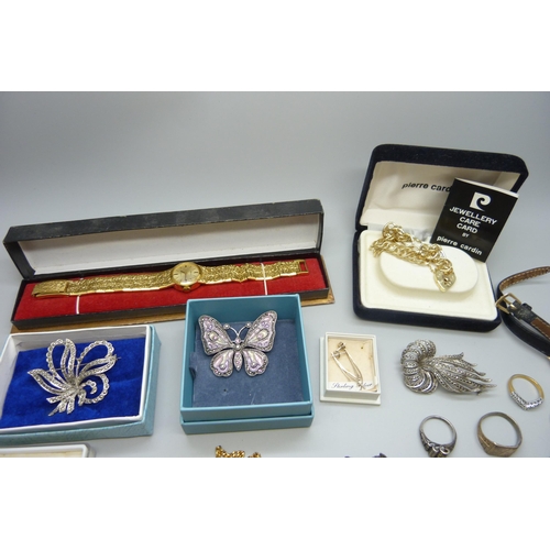 7165 - A collection of costume jewellery and wristwatches including two silver rings, etc.