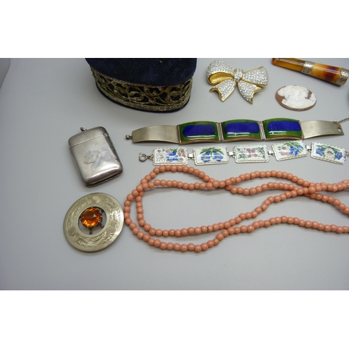 7167 - Two unmounted cameos, a silver mounted cheroot holder, a silver brooch, a plated panel bracelet, etc... 