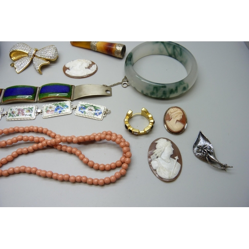 7167 - Two unmounted cameos, a silver mounted cheroot holder, a silver brooch, a plated panel bracelet, etc... 