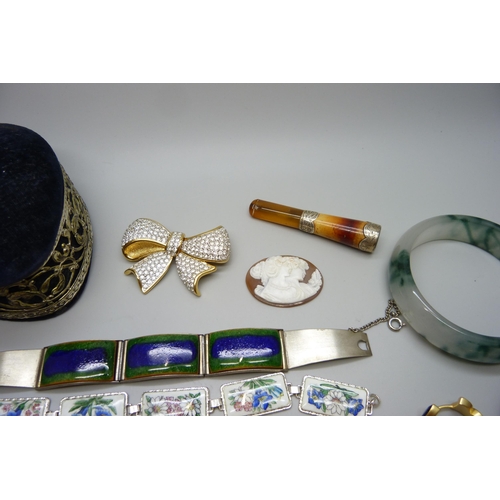 7167 - Two unmounted cameos, a silver mounted cheroot holder, a silver brooch, a plated panel bracelet, etc... 