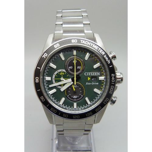 7199 - A Citizen Eco-Drive wristwatch with green dial and black bezel, boxed, 47mm including crown