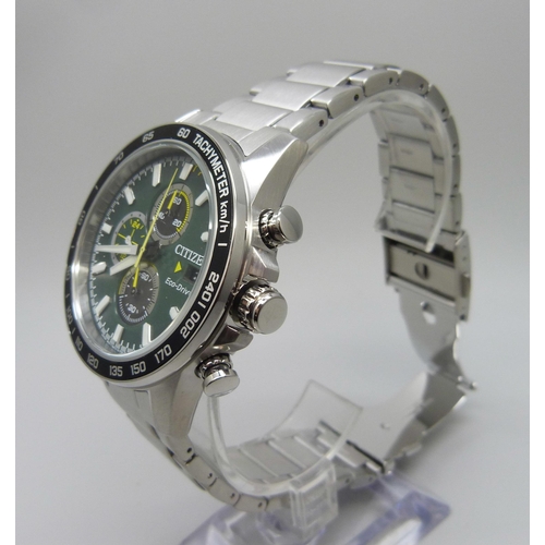 7199 - A Citizen Eco-Drive wristwatch with green dial and black bezel, boxed, 47mm including crown