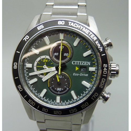 7199 - A Citizen Eco-Drive wristwatch with green dial and black bezel, boxed, 47mm including crown