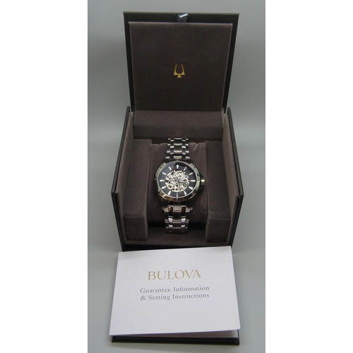 7200 - A Bulova wristwatch with skeleton dial, 45mm including crown, boxed