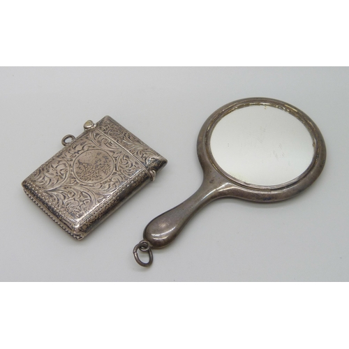 7226 - A silver handbag mirror, 8.7cm and a silver vesta case, 20g