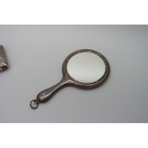 7226 - A silver handbag mirror, 8.7cm and a silver vesta case, 20g