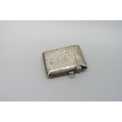 7226 - A silver handbag mirror, 8.7cm and a silver vesta case, 20g