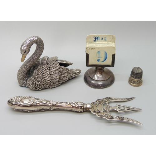 7229 - A silver covered model of a swan, hallmarked and stamped 'filled', a white metal propelling pencil s... 