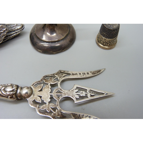 7229 - A silver covered model of a swan, hallmarked and stamped 'filled', a white metal propelling pencil s... 