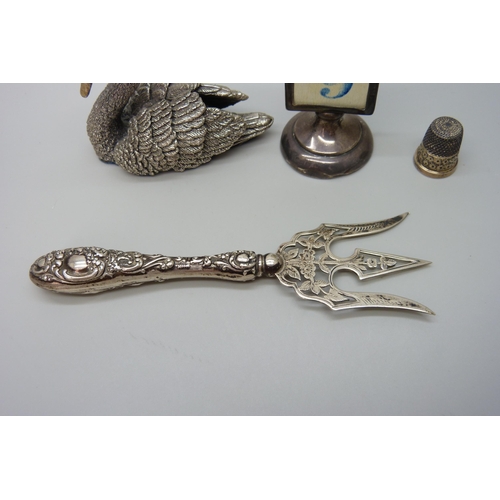 7229 - A silver covered model of a swan, hallmarked and stamped 'filled', a white metal propelling pencil s... 