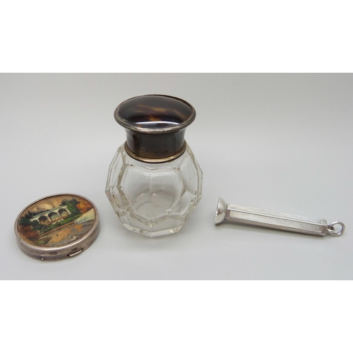 7230 - A silver and tortoiseshell topped scent bottle, with stopper, together with a TLM silver compact wit... 