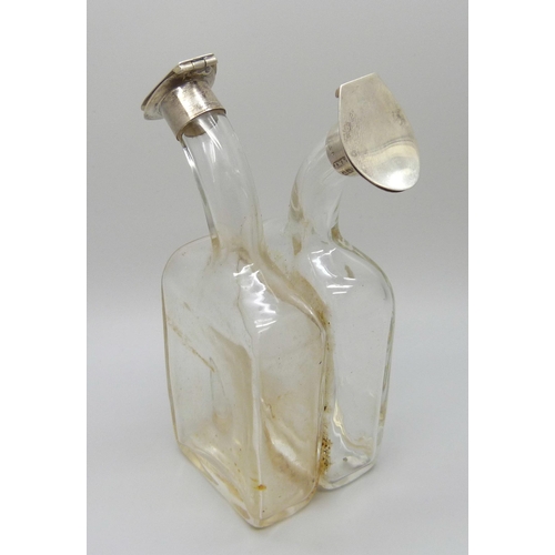 7233 - Silver mounted oil/vinegar glass bottle, J.W & S, Birmingham 1911, 13cm