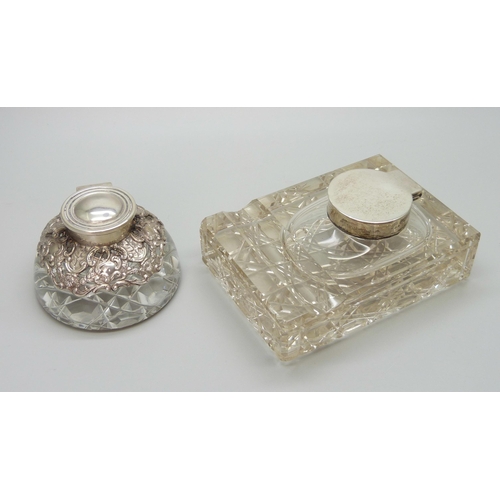 7236 - Two silver topped inkwells, ornate example Birmingham 1903, glass a/f on the other, 10.1 x 7.3cm