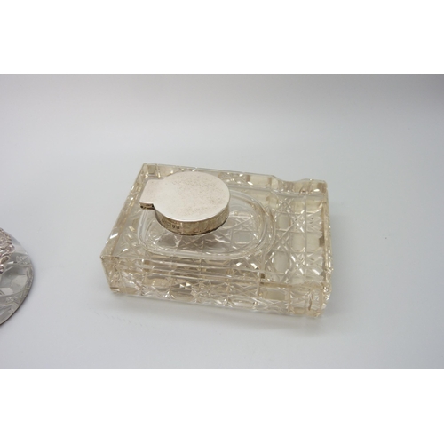 7236 - Two silver topped inkwells, ornate example Birmingham 1903, glass a/f on the other, 10.1 x 7.3cm