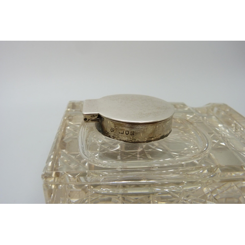 7236 - Two silver topped inkwells, ornate example Birmingham 1903, glass a/f on the other, 10.1 x 7.3cm