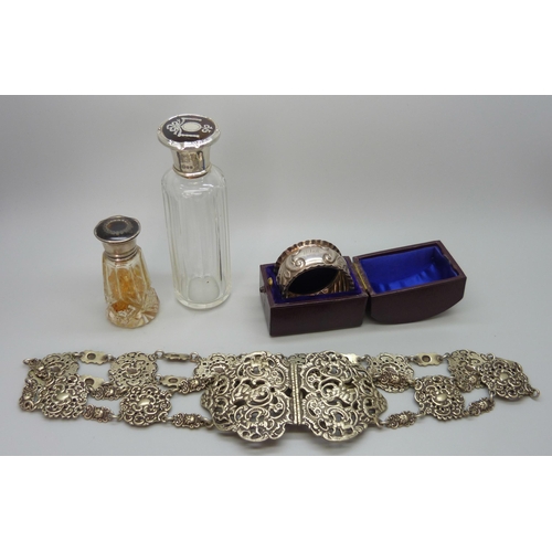 7237 - Two silver topped dressing table bottles set with tortoiseshell, a silver napkin ring and a plated b... 