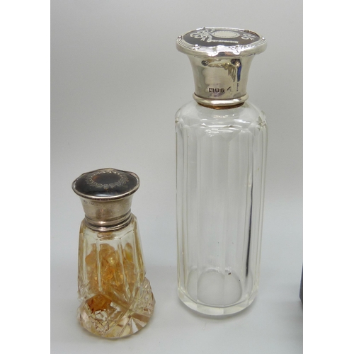 7237 - Two silver topped dressing table bottles set with tortoiseshell, a silver napkin ring and a plated b... 