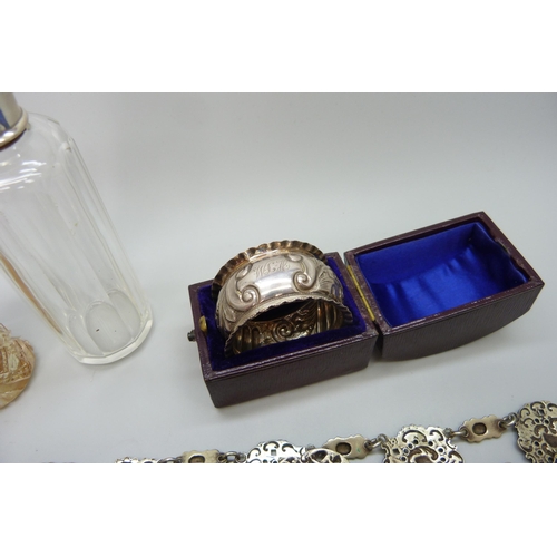 7237 - Two silver topped dressing table bottles set with tortoiseshell, a silver napkin ring and a plated b... 