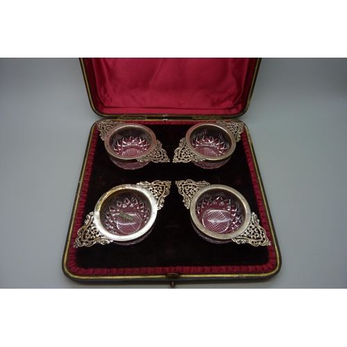 7239 - A set of four silver mounted cut glass salts, Birmingham 1899, 10cm, cased