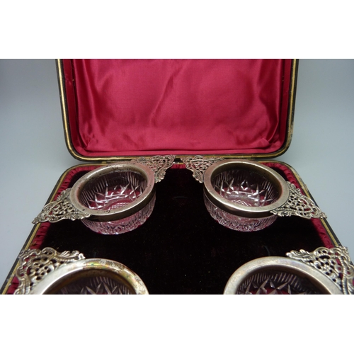 7239 - A set of four silver mounted cut glass salts, Birmingham 1899, 10cm, cased