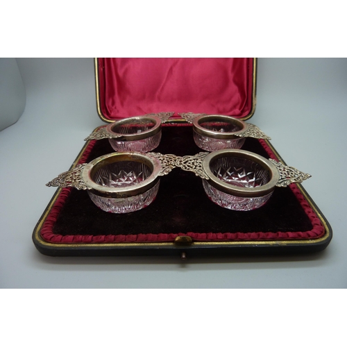 7239 - A set of four silver mounted cut glass salts, Birmingham 1899, 10cm, cased