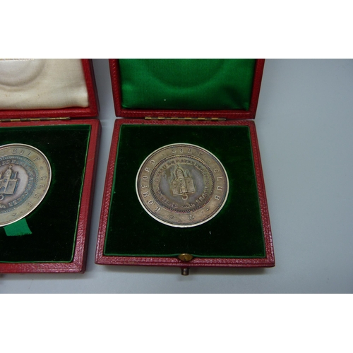 7304 - Two silver Romford Golf Club medallions, cased