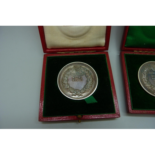 7304 - Two silver Romford Golf Club medallions, cased