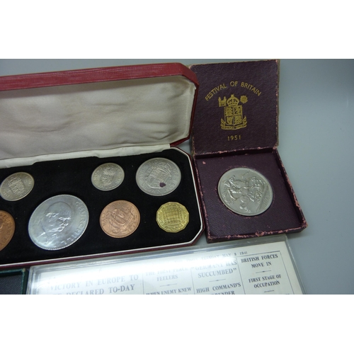 7305 - A 1965 Churchill coin set, a Victory in Europe coin, a J.F. Kennedy coin and two Festival of Britain... 