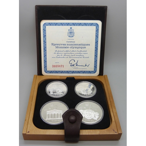 7308 - A set of Canadian Mint sterling silver proof 1976 Olympics coins, cased and with certificate