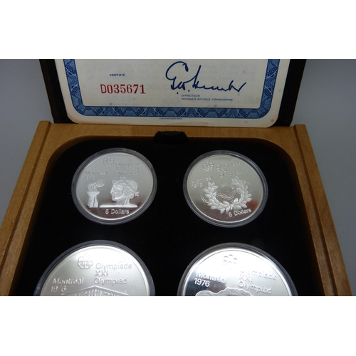 7308 - A set of Canadian Mint sterling silver proof 1976 Olympics coins, cased and with certificate