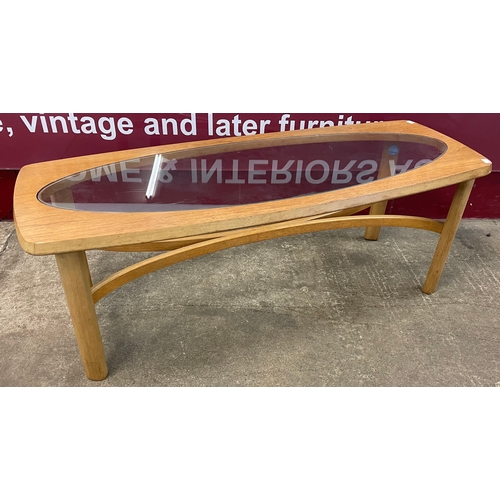 14 - A Nathan teak and glass topped rectangular coffee table