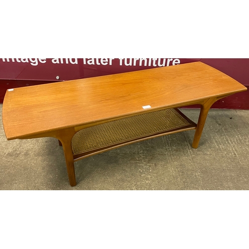 20 - A teak and rattan coffee table