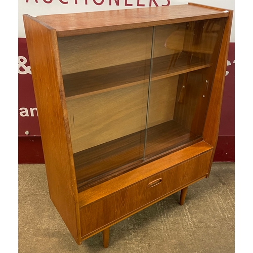 21 - A teak bookcase