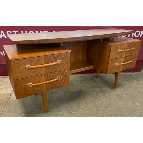 22 - A teak floating top desk