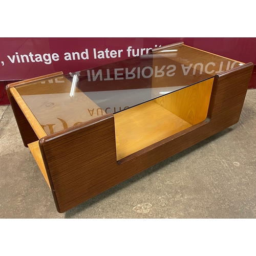 52 - A teak and glass topped rectangular coffee table