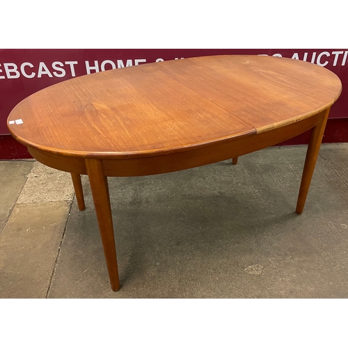 53 - A Jentique teak oval extending dining table