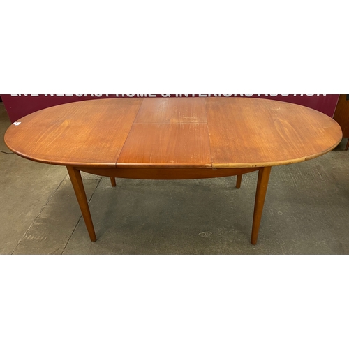 53 - A Jentique teak oval extending dining table