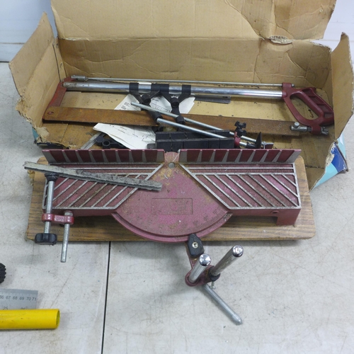 5010 - A box of 14 hand saws, a bow saw, a square rule, an Irwin Hilmor type GLM pipe bender and a precisio... 