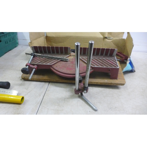 5010 - A box of 14 hand saws, a bow saw, a square rule, an Irwin Hilmor type GLM pipe bender and a precisio... 