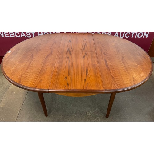 55 - A G-Plan Fresco teak circular extending dining table and six chairs