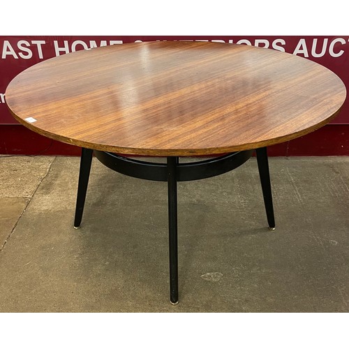 67 - A G-Plan Librenza tola wood and black circular dining table