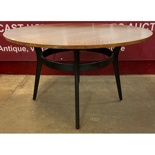 67 - A G-Plan Librenza tola wood and black circular dining table