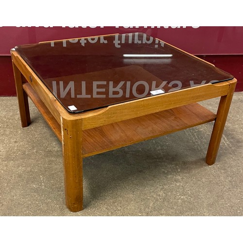 68 - A Myer teak and smoked glass topped coffee table