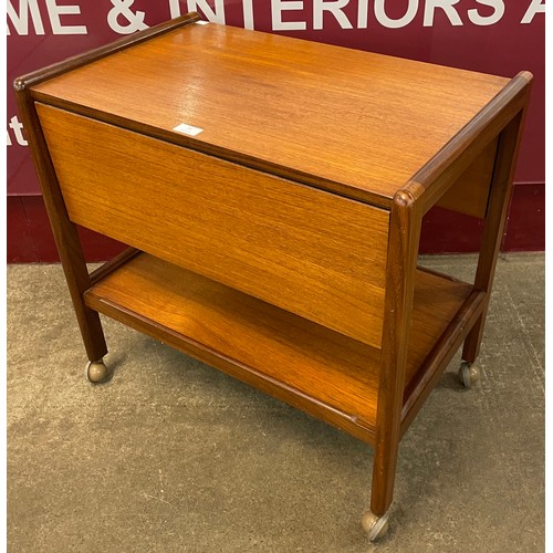 73 - A teak drop leaf cocktail trolley