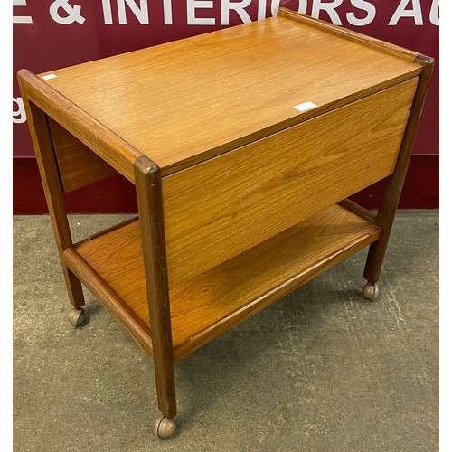 74 - A teak drop leaf cocktail trolley