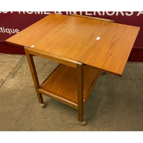 74 - A teak drop leaf cocktail trolley